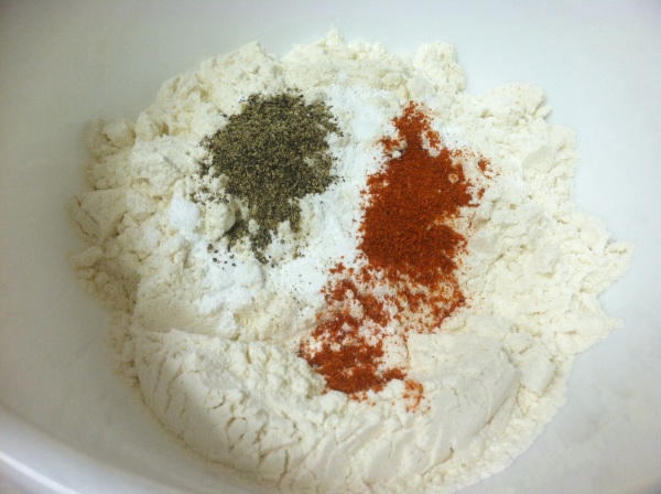 Mix flour with cayenne and ground black pepper.